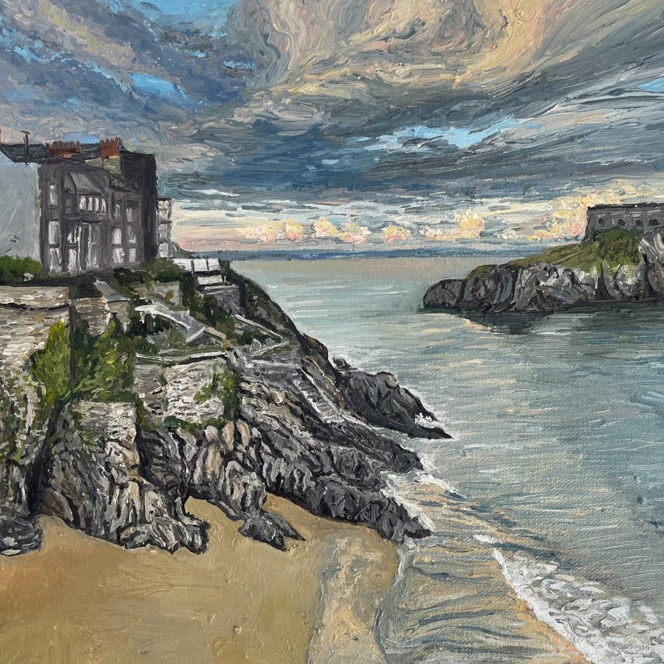 Tenby Castle Tenby Castle scene with rocky shore, buildings, and a cloudy sky over the water.